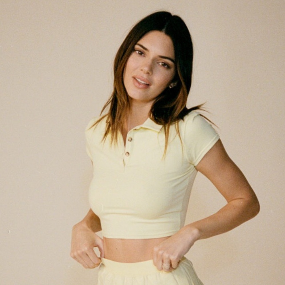 Alo yoga yellow cropped collared tee.